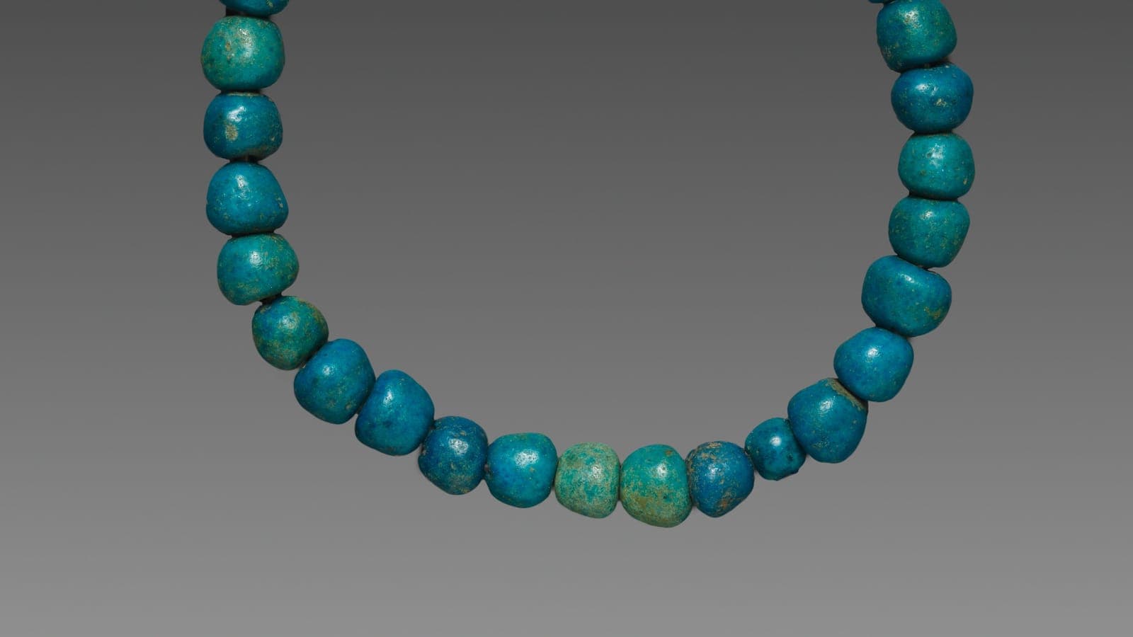 A string of turquoise prayer beads