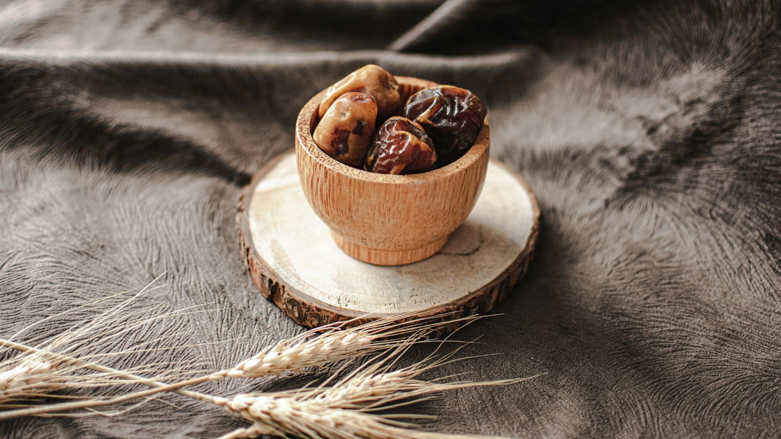 A bowl of dates on a table